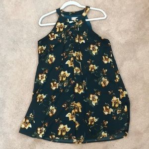 Green dress with floral details. Lace up front